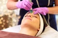 Woman having microdermabrasion facial treatment Royalty Free Stock Photo