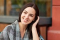 People, beauty, emotions and lifestyle concept. Close up portrait of brunette female with appealing look, enjoys calm peaceful atm