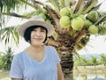 Outdoors close up portrait of girl smiling or Asian woman smiling in the park and looking at camera Royalty Free Stock Photo