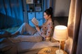 teenage girl reading book in bed at home Royalty Free Stock Photo