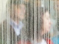 People behind white straight strands texture background, fiber pattern, Sewing equipment, Loom equipment, Thread texture.