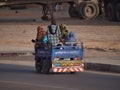 People being carried on three-wheelers in the streets of Nouakchott, Mauritania