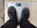 people are being weighed at sixty-eight kilos Royalty Free Stock Photo