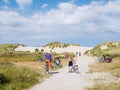 People with bikes in dunes in nature reserve Het Oerd on West Frisian island Ameland, Friesland, Netherlands