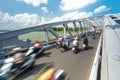 People on bikes on bridge of Hue, Vietnam, Asia. Royalty Free Stock Photo