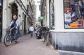 People and bikes near souvenir shop in centre of amsterdam in ho