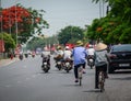 People biking on street in Haiphong, Vietnam