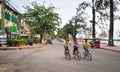 People biking on street in Kampot, Cambodia