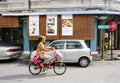 People biking on street in Melaka, Malaysia