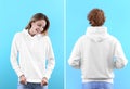 People in blank hoodie sweaters on color background, front and back views. Royalty Free Stock Photo