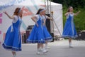 People in blue Russian national costumes dance at the International Festival Ã¢â¬ÅHave Contact