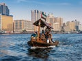 People on board of abra water taxi across the Creek in Dubai Royalty Free Stock Photo