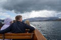 People on board a boat at Derwentwater lake. Keswick Launch, Keswick, The Lake District, Cumbria UK