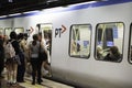 People board the newly arrived train at a station of the Melbourne Royalty Free Stock Photo