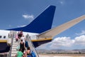 People board a plane