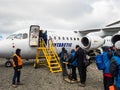 People boarding an Antarctic Airways flight at King George Island, Antarctica