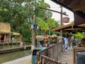 People boarding a Jungle Cruise ride boat in the Magic Kingdom at Walt Disney World Resorts in Orlando, FL