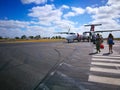 People boarding a Qantas domestic airline Aircraft Type: De Havilland Dhc-8-300 Dash 8/8q at Emerald airport.