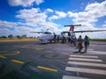 People boarding a Qantas domestic airline Aircraft Type: De Havilland Dhc-8-300 Dash 8/8q at Emerald airport.