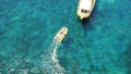 People on boat from above, sailing in Greece and summer sun on ocean holiday, relax in freedom and nature. Yacht Royalty Free Stock Photo