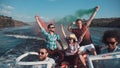 People on boat with colored smoke Royalty Free Stock Photo