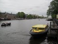 People in the boat on river in Amsterdam. 