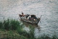 People in Boat on River Floating Village in Cambodia Asia. poor Cambodian family lives in boat on the water. Poverty in Southeast