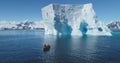 People boat tour expedition to Antarctica iceberg Royalty Free Stock Photo