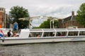 People in the boat on tours of the canals of Amsterdam Royalty Free Stock Photo