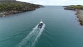 People in boat on water surface on Stts Dalniye Zelentsy in Barents Sea.