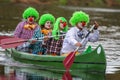 People boating on river. People are dressed for clowns in boat. Royalty Free Stock Photo