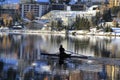 People boating in St. Moritz lake in winter