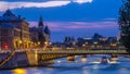 People and boats day to night timelapse, Le Pont D'Arcole bridge after sunset, Paris, France, Europe