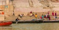 People and boats at the river Ganges at the Lalita Ghat in Varanasi