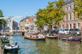 People in boats on Voordam canal in Alkmaar, Netherlands