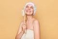 People and body treatment after shower Smiling beautiful young woman using dry brush for body has healthy smooth skin smiles Royalty Free Stock Photo