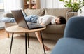 Sick bored woman with laptop lying on sofa at home Royalty Free Stock Photo