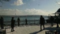 People by the Bosphorus in Istanbul, it snowed after 100 years
