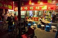 People bought food at a Chinese restaurant in the late evening