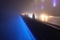 People on the bridge fog night lights Royalty Free Stock Photo