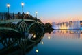 People on bridge and fountain on sunset. Moscow.