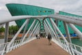 People on the bridge to the Nemo museum in Amsterdam Royalty Free Stock Photo