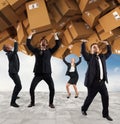 People buried by a stack of cardboard boxes. Concept of internet shopping addiction Royalty Free Stock Photo