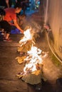 People burning paper in a religious festival ceremony