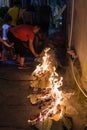 People burning paper in a religious festival ceremony