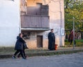 people at the bus stop. Urban environment. Asian city streets. cozy yard. winter in the south Royalty Free Stock Photo