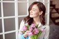 People, business, sale and floristry concept - close-up of florist woman holding bunch at flower shop. Royalty Free Stock Photo