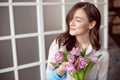 People, business, sale and floristry concept - close-up of florist woman holding bunch at flower shop. Royalty Free Stock Photo