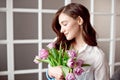 People, business, sale and floristry concept - close-up of florist woman holding bunch at flower shop. Royalty Free Stock Photo