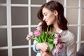 People, business, sale and floristry concept - close-up of florist woman holding bunch at flower shop. Royalty Free Stock Photo